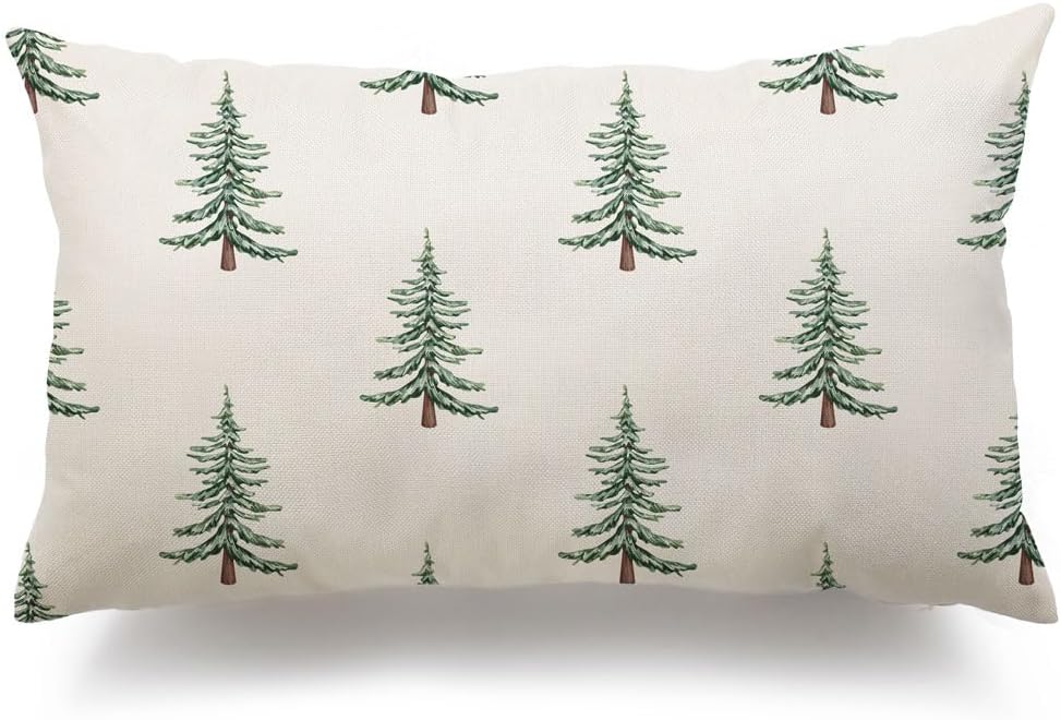 Rectangular pillow with a pattern of green pine trees on a cream background.