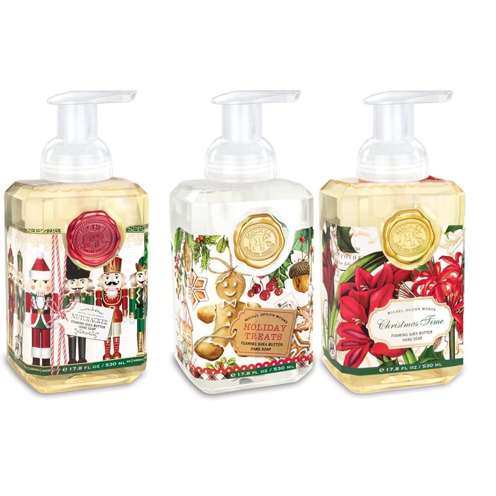 Three pump bottles of hand soap with festive labels: Nutcracker, Holiday Treats, and Christmas Time. The designs feature holiday-themed images and colors.