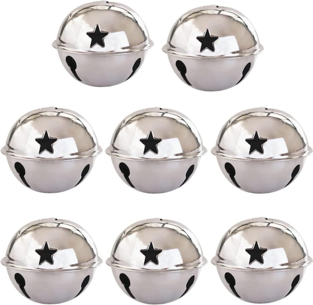 Seven silver jingle bells with black star cutouts arranged in two rows, capturing the essence of Christmas joy.