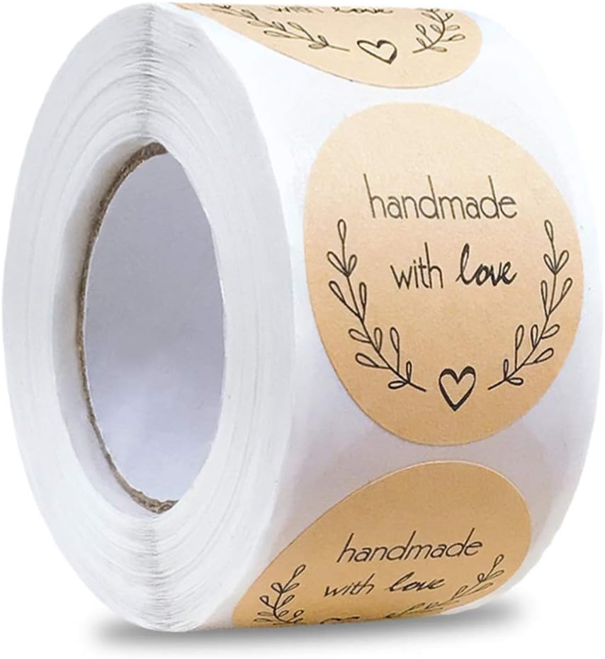 A roll of round, beige stickers with the text "handmade with love" and decorative leaf designs, perfect for labeling handmade items—especially during the season of giving.