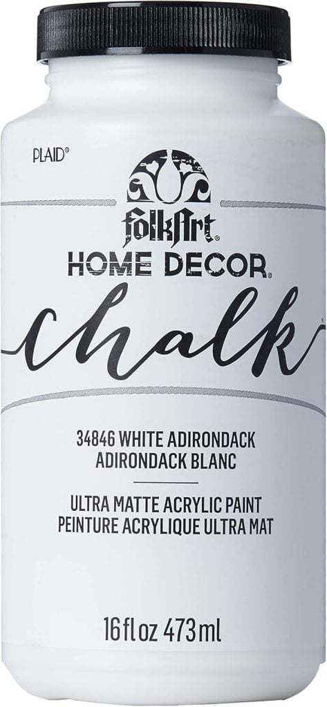 A container of FolkArt Home Decor Chalk, capturing the essence of Christmas joy, labeled "White Adirondack," 16 fl oz (473 ml), ultra matte acrylic paint.