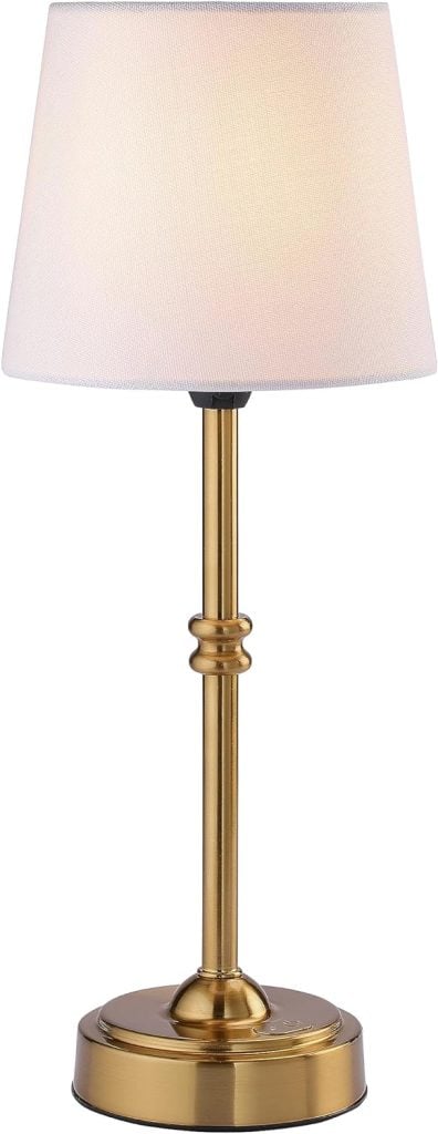 A brass table lamp with a white fabric shade on a round base, perfect for adding a warm glow to your Christmas party ambiance.