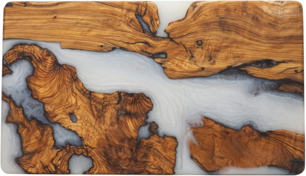 A slab of wood and resin art with swirling patterns of brown and cream, resembling a natural landscape.