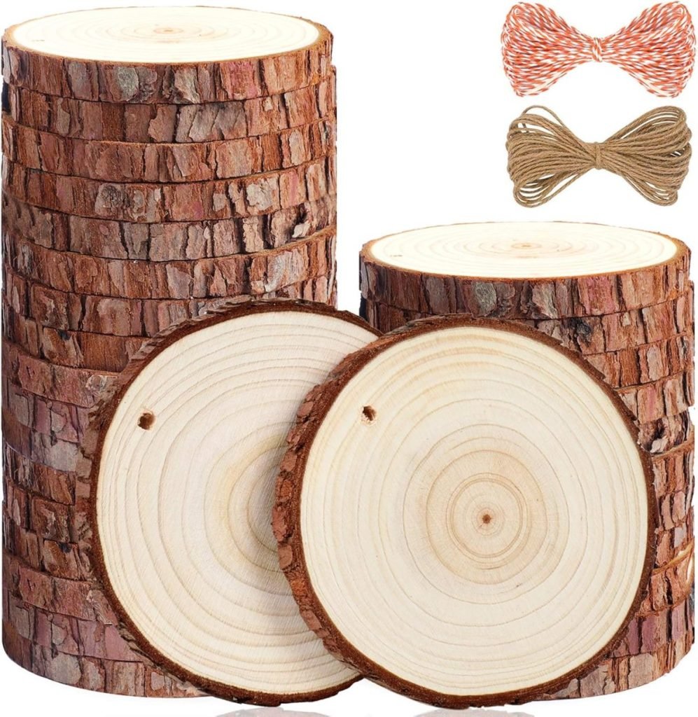 Stacked round wood slices with bark visible, accompanied by orange and white twine and brown string, evoke a rustic charm reminiscent of Christmas joy.