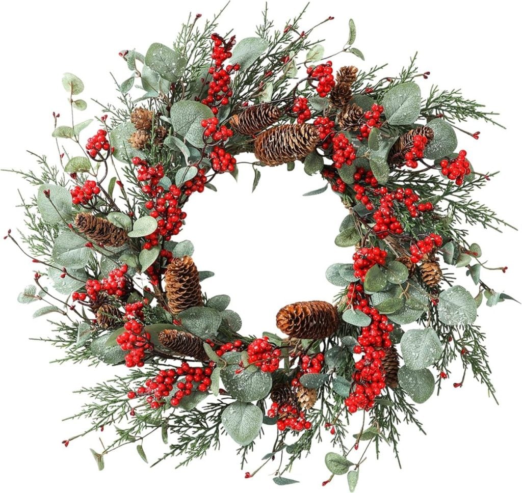 Festive wreath with pinecones, red berries, and green foliage arranged in a circular pattern.