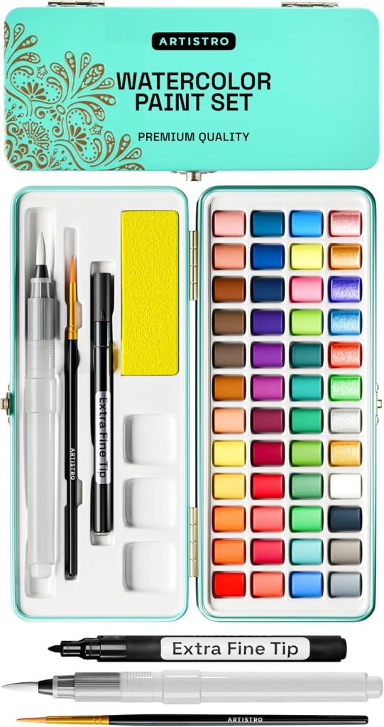 Open watercolor paint set tin with 48 color pans, two brushes, water brush pen, palette, Extra Fine Tip marker, and yellow sponge arranged neatly inside—a perfect creative gift for the season of giving.