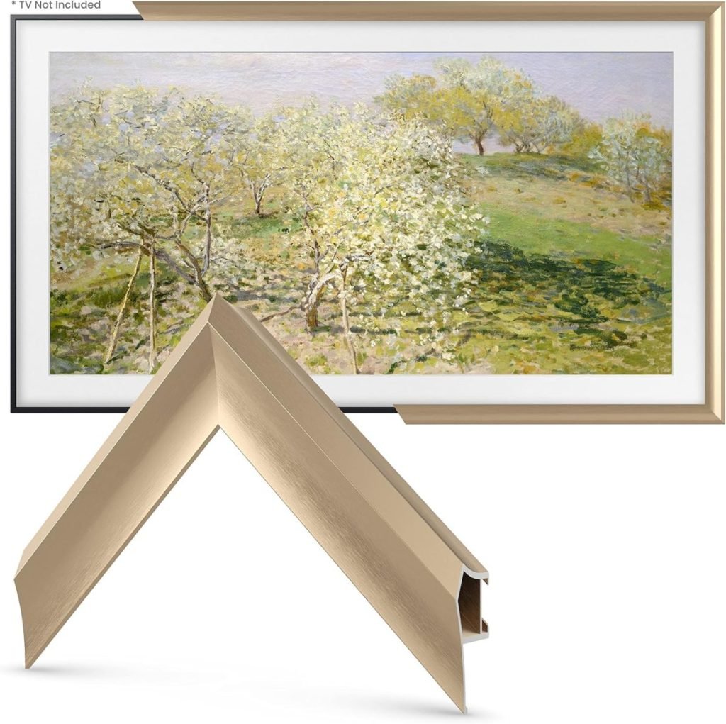 Gold picture frame with a corner detail displayed in front of a landscape painting of a field and trees in bloom.