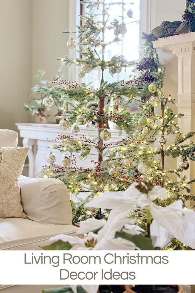 Living room with a decorated Christmas tree, white couch, and poinsettia plant. Text reads "Living Room Christmas Decor Ideas.