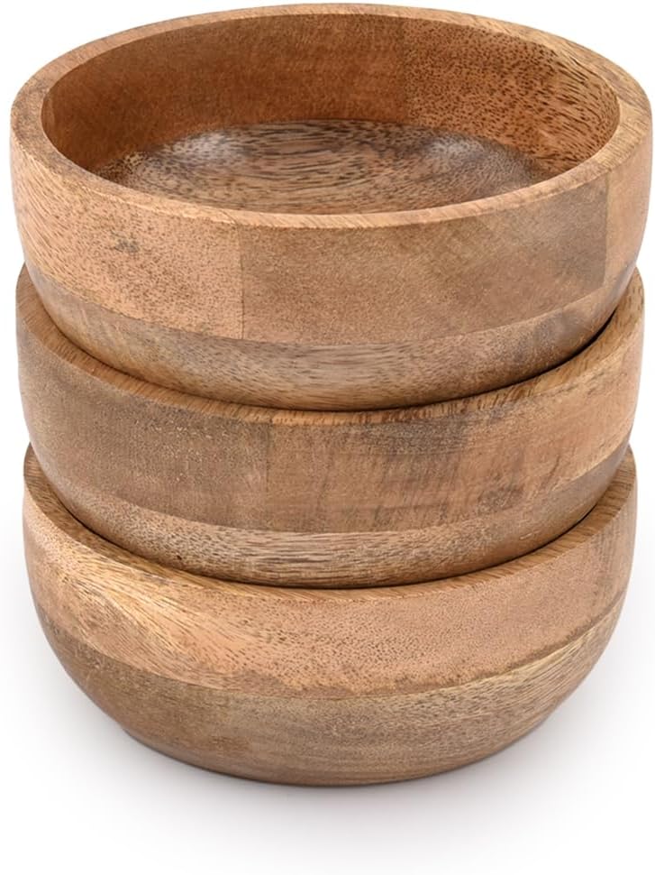 Three stacked wooden bowls with a natural finish.