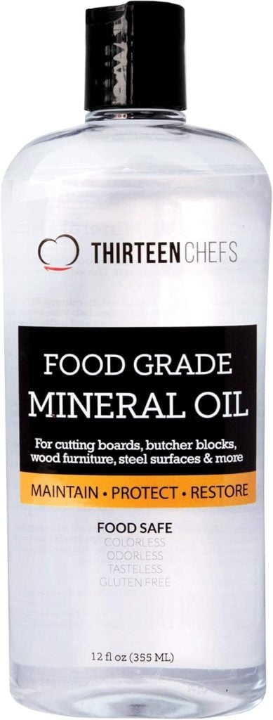 A bottle labeled "Thirteen Chefs Food Grade Mineral Oil," 12 fl oz (355 ml), is a must-have for maintaining your kitchen items like cutting boards, butcher blocks, and more.