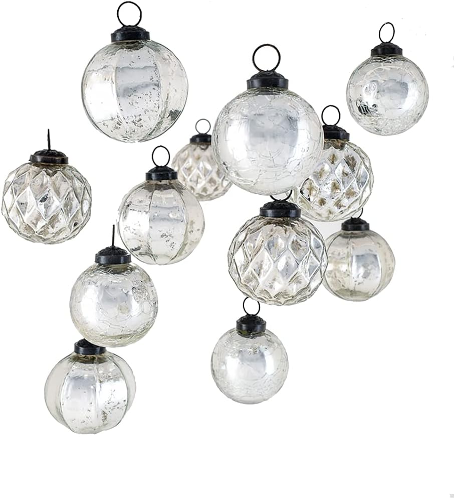 A collection of clear, textured glass ornaments with black metal caps, hanging against a white background.