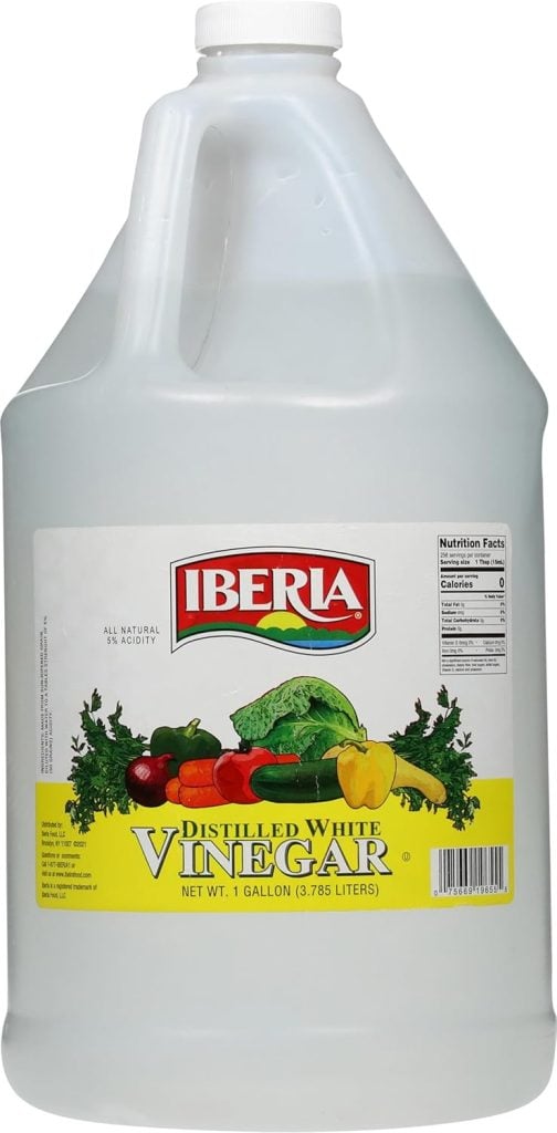 A gallon bottle of Iberia distilled white vinegar with a label showing various vegetables.