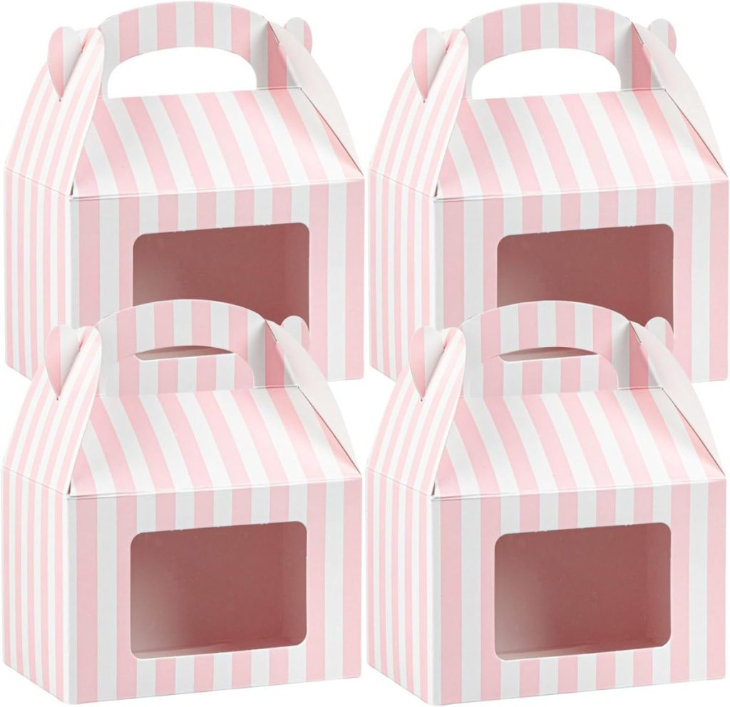 Four pink and white striped cardboard gift boxes with clear window panels and handles, perfect for presenting Valentine's Day Cards, arranged in a group.