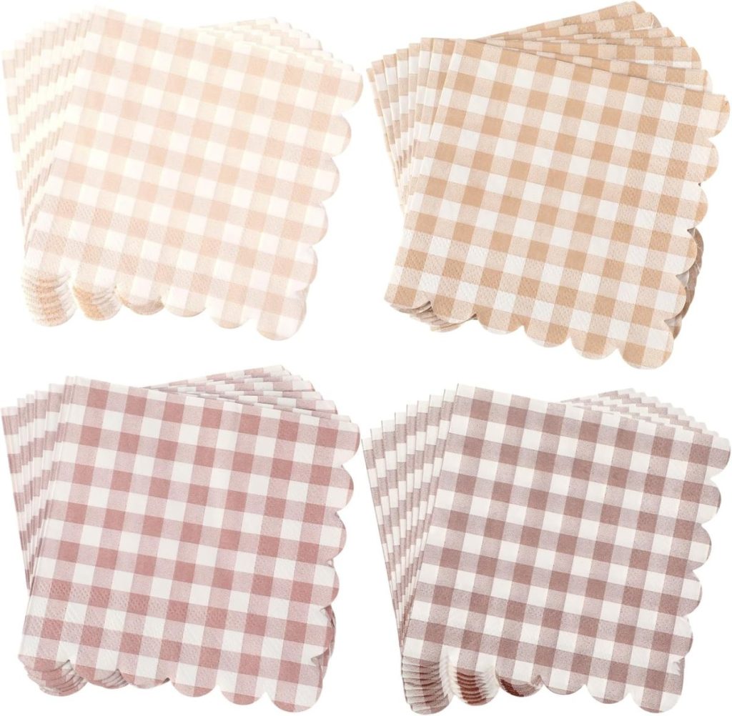 Four stacks of gingham-patterned napkins in brown shades, each with scalloped edges.