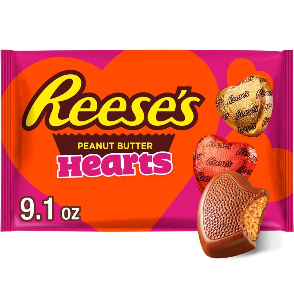 Reese’s Peanut Butter Hearts 9.1 oz package with images of heart-shaped chocolate candies, one cut open to show peanut butter filling—perfect for displaying in glass apothecary jars at your next celebration.