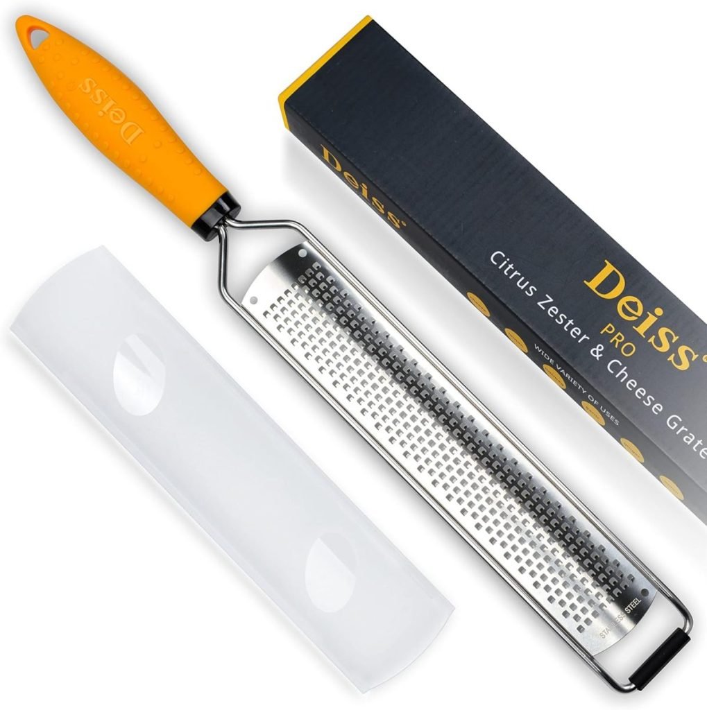 The Deiss Pro zester and cheese grater, featuring vibrant orange handles, is a must-have among kitchen items. It comes with a protective cover and a sleek packaging box for easy storage and convenience.