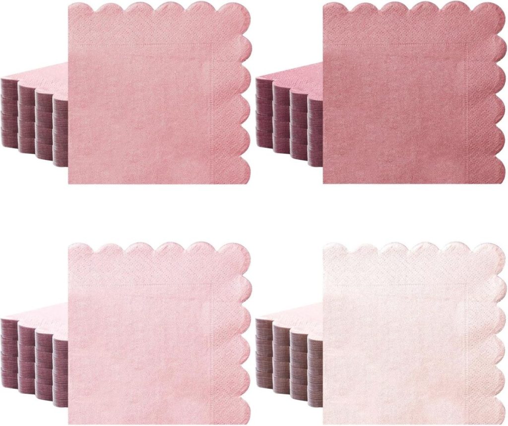 Four stacks of pink scalloped paper napkins are arranged in a grid.