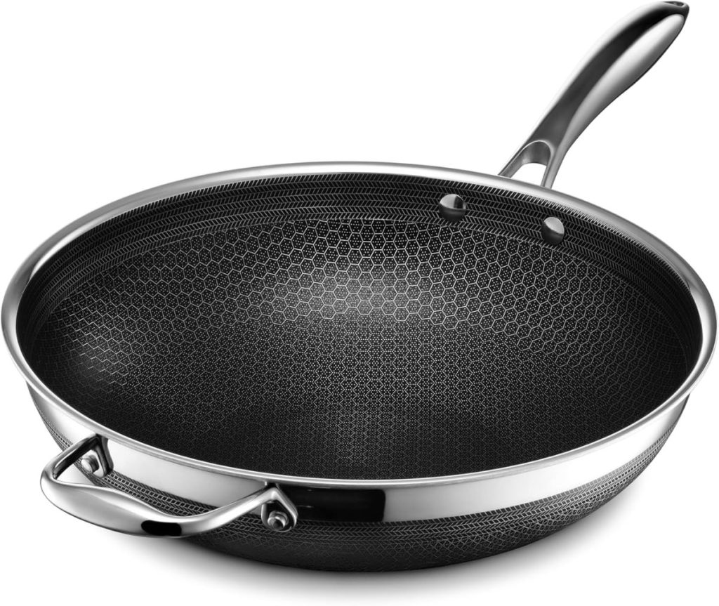 Stainless steel frying pan with a honeycomb-patterned nonstick interior, a long handle, and an additional helper handle—an essential addition to your kitchen items—shown on a white background.