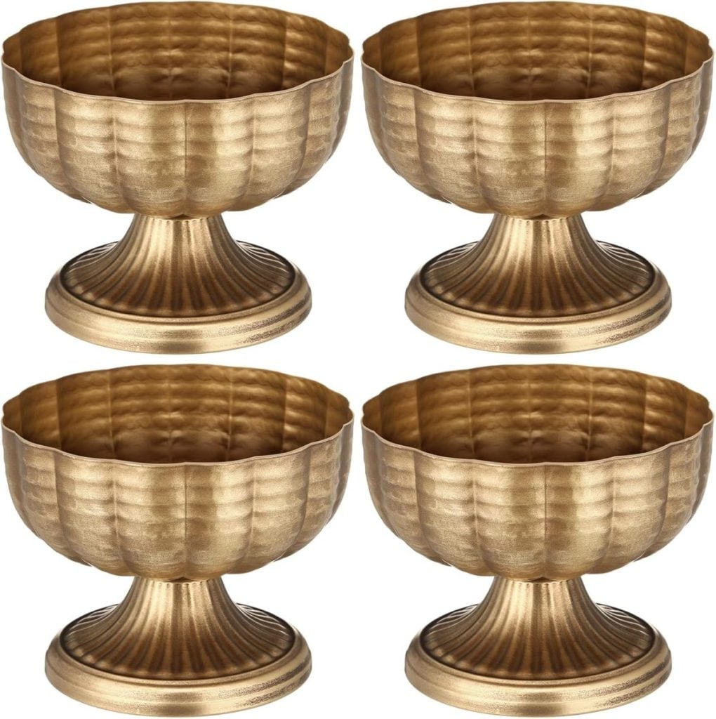 Four identical gold-colored, textured metal dessert bowls with wide bases are arranged in a grid on a white background—perfect as chic Valentine table decorations.