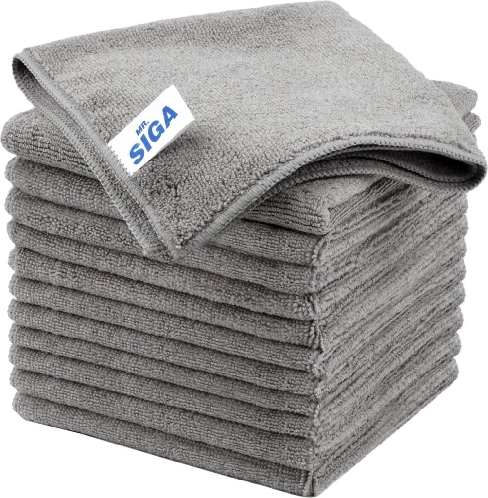 A stack of gray microfiber cleaning cloths with a small white tag labeled "MR. SIGA" on the top cloth.