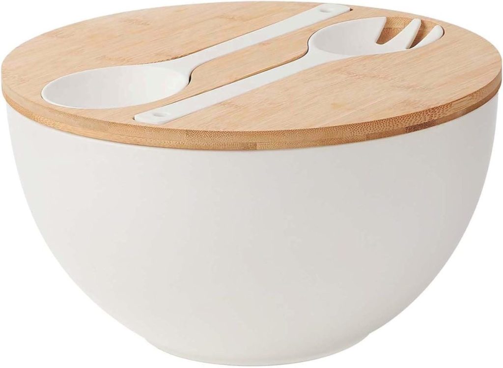 A white bowl with a wooden lid, featuring an integrated slot holding a white plastic spoon and fork—perfect for serving salad dressing in style.