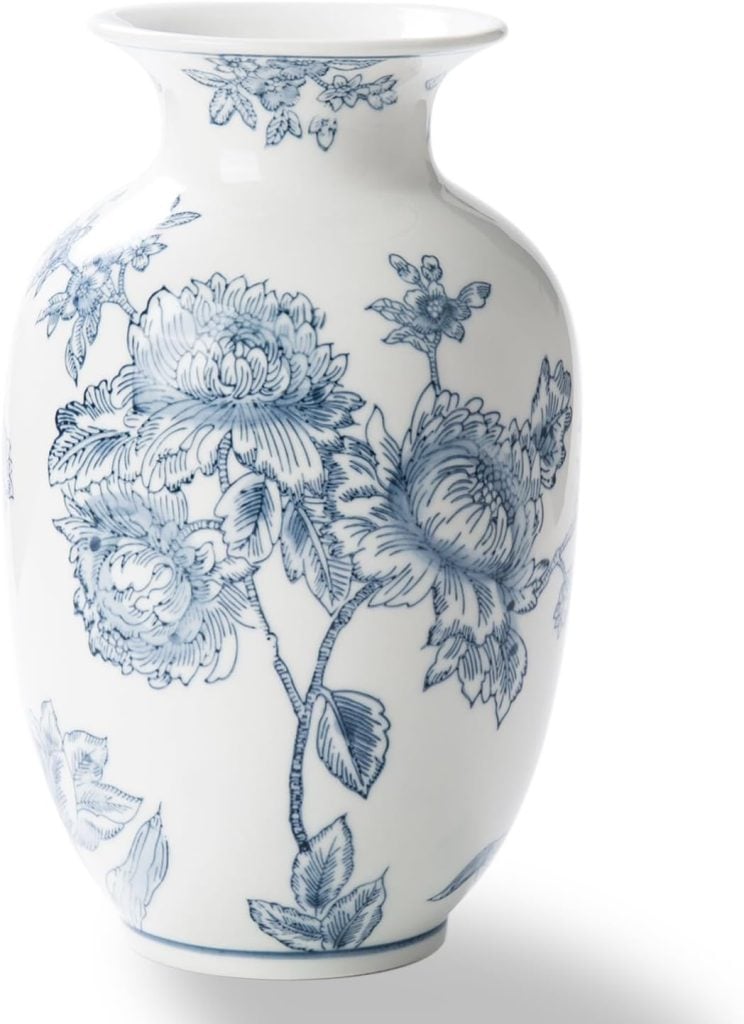 White porcelain vase with a wide rim, decorated with intricate blue floral designs&mdash;perfect for displaying your best faux flowers in style.