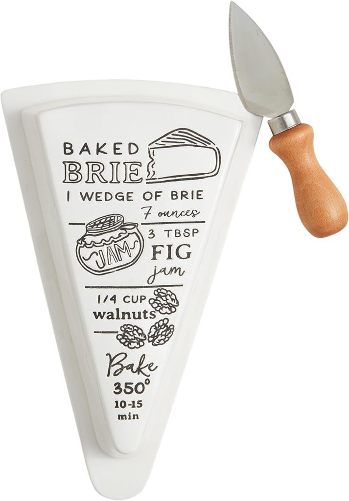 A wedge-shaped ceramic dish features a baked brie with jam recipe, complete with ingredient illustrations and step-by-step instructions, placed beside a small cheese knife with a wooden handle.