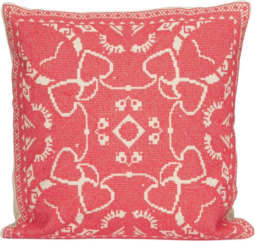 A red and white pillow, perfect for cozying up, makes a charming addition to your collection of Valentine's Day ideas.