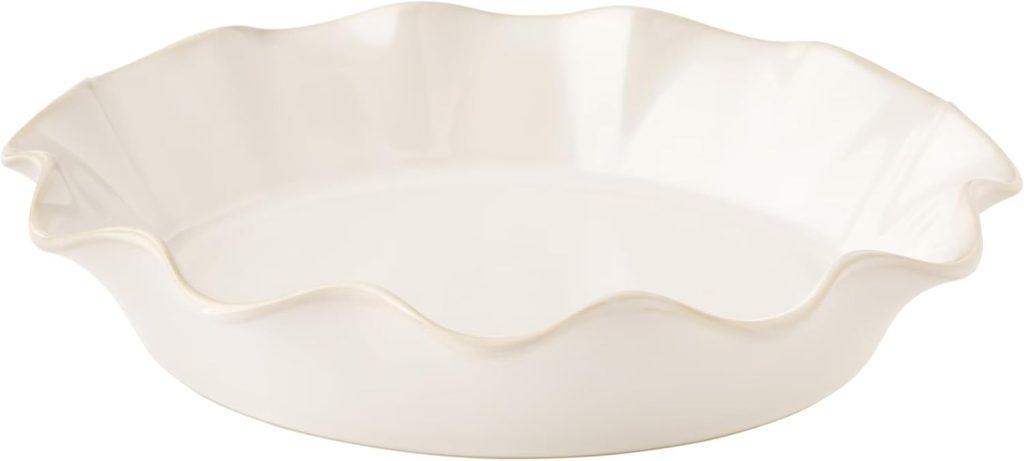 A white ceramic pie dish with a fluted, wavy edge, perfect for displaying your Easter Eggs DIY creations, shown on a plain background.
