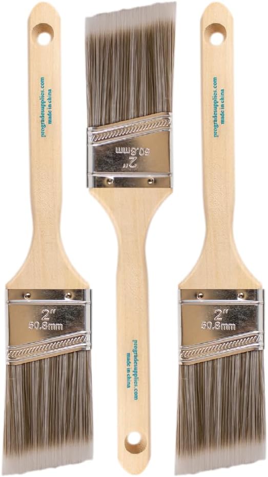 Three identical paint brushes with light wooden handles and wide bristles are arranged side by side, each labeled 2" 50.8 mm—perfect tools for crafting fresh spring decor updates in your home.