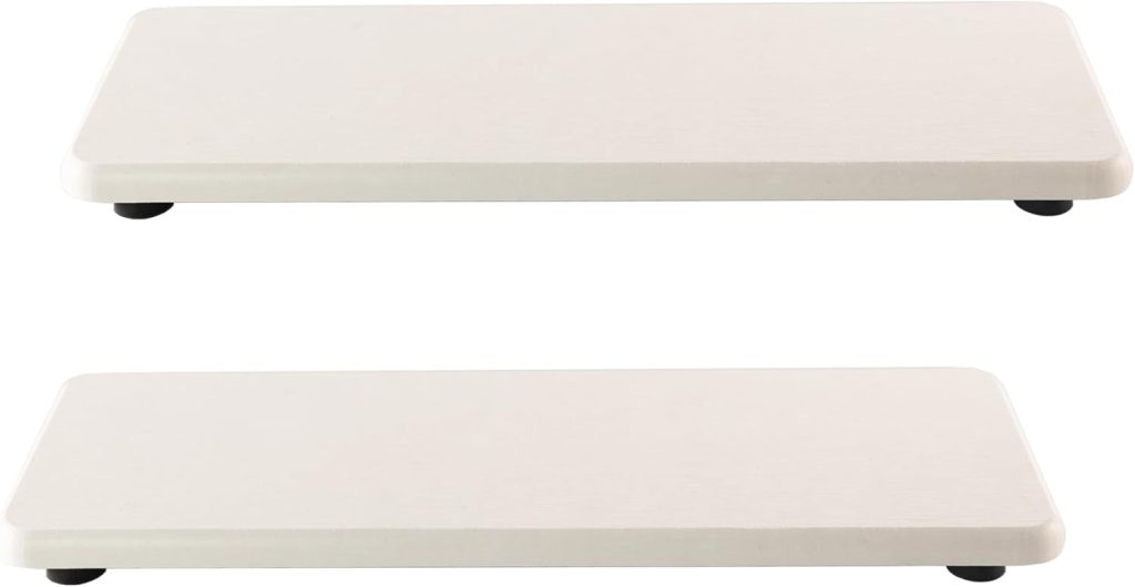 Two rectangular white floating shelves with rounded corners are mounted horizontally against a plain background, making for an easy DIY project to enhance any room's decor.