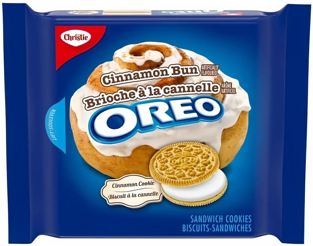 A package of Oreo sandwich cookies in cinnamon bun flavor, featuring an image of a cinnamon bun and vanilla cookies with white filling on the front.