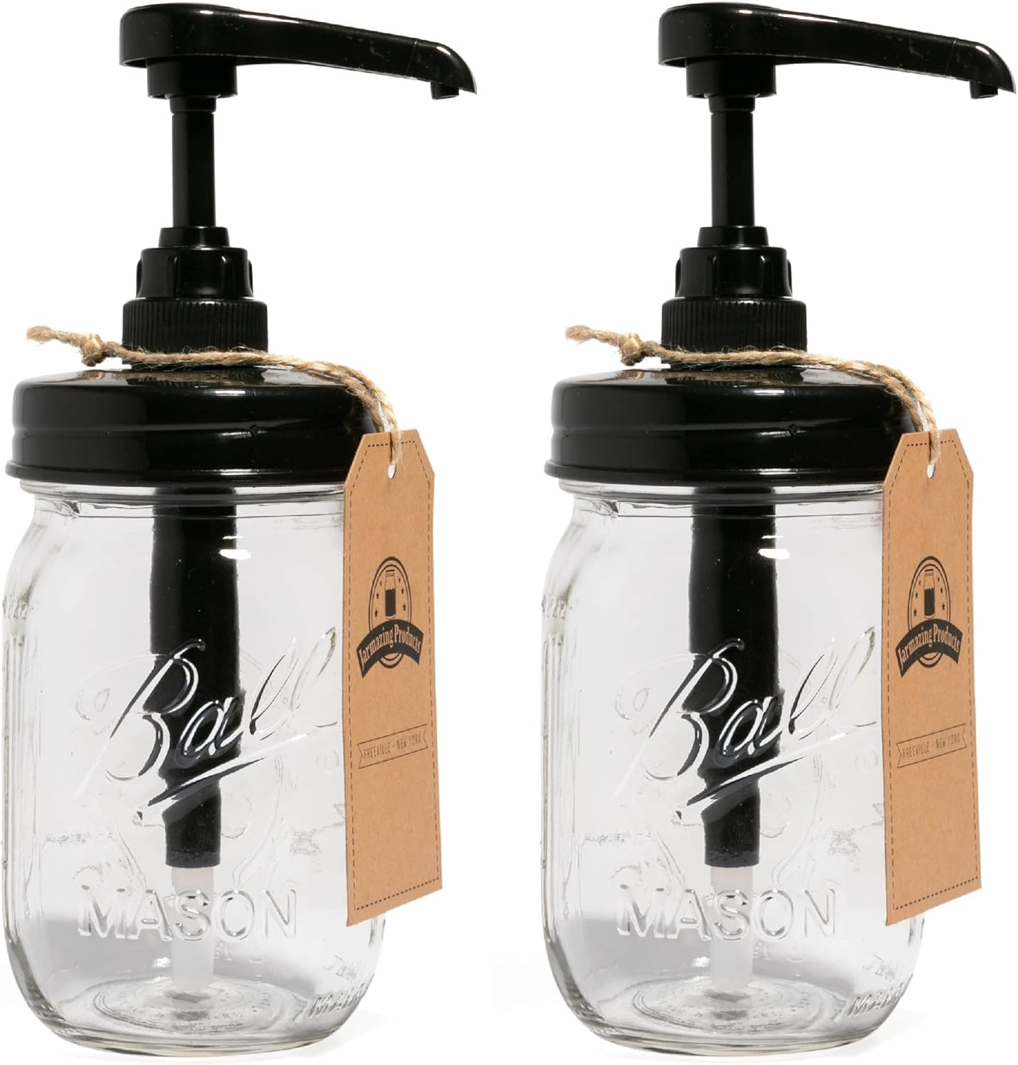 Two clear Ball Mason jars with black pump dispensers and brown tags attached by twine, standing side by side on a white background.