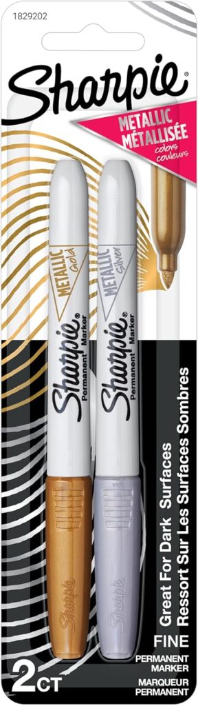 Package of two Sharpie permanent markers in metallic gold and silver, perfect for marking on dark surfaces or decorating plastic Easter eggs.