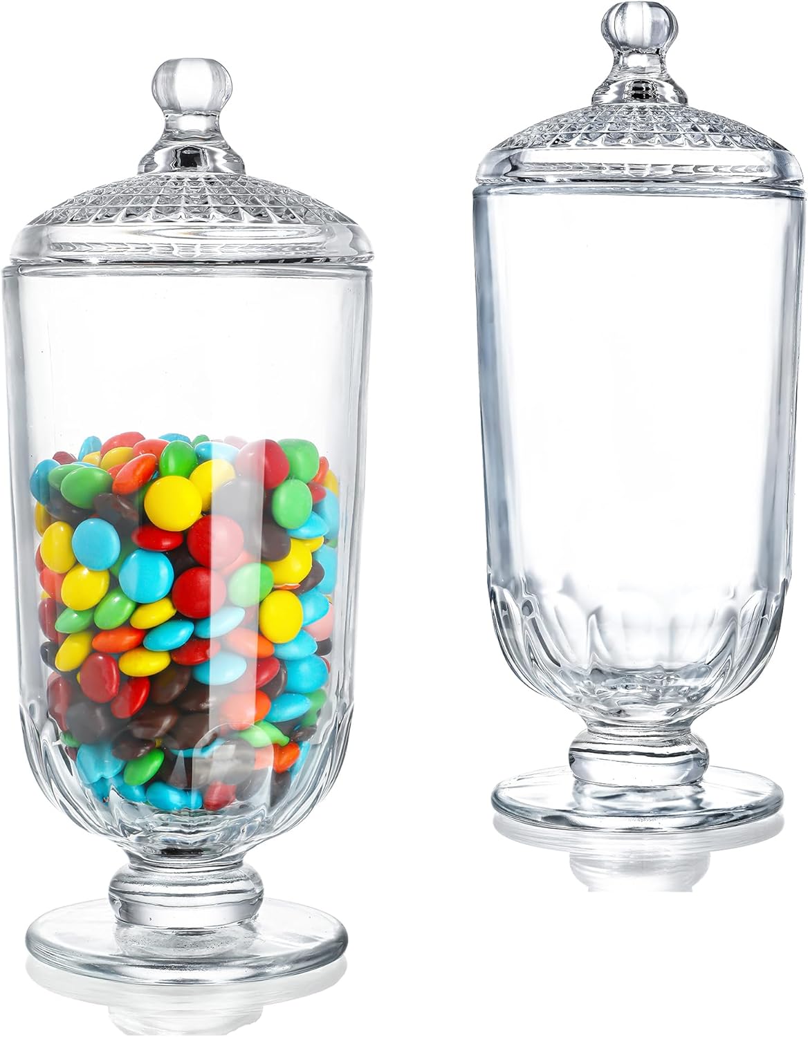 Two clear glass jars with lids; one jar is filled with colorful candy-coated chocolates and the other stands empty, perfect for holding treats or plastic Easter eggs.