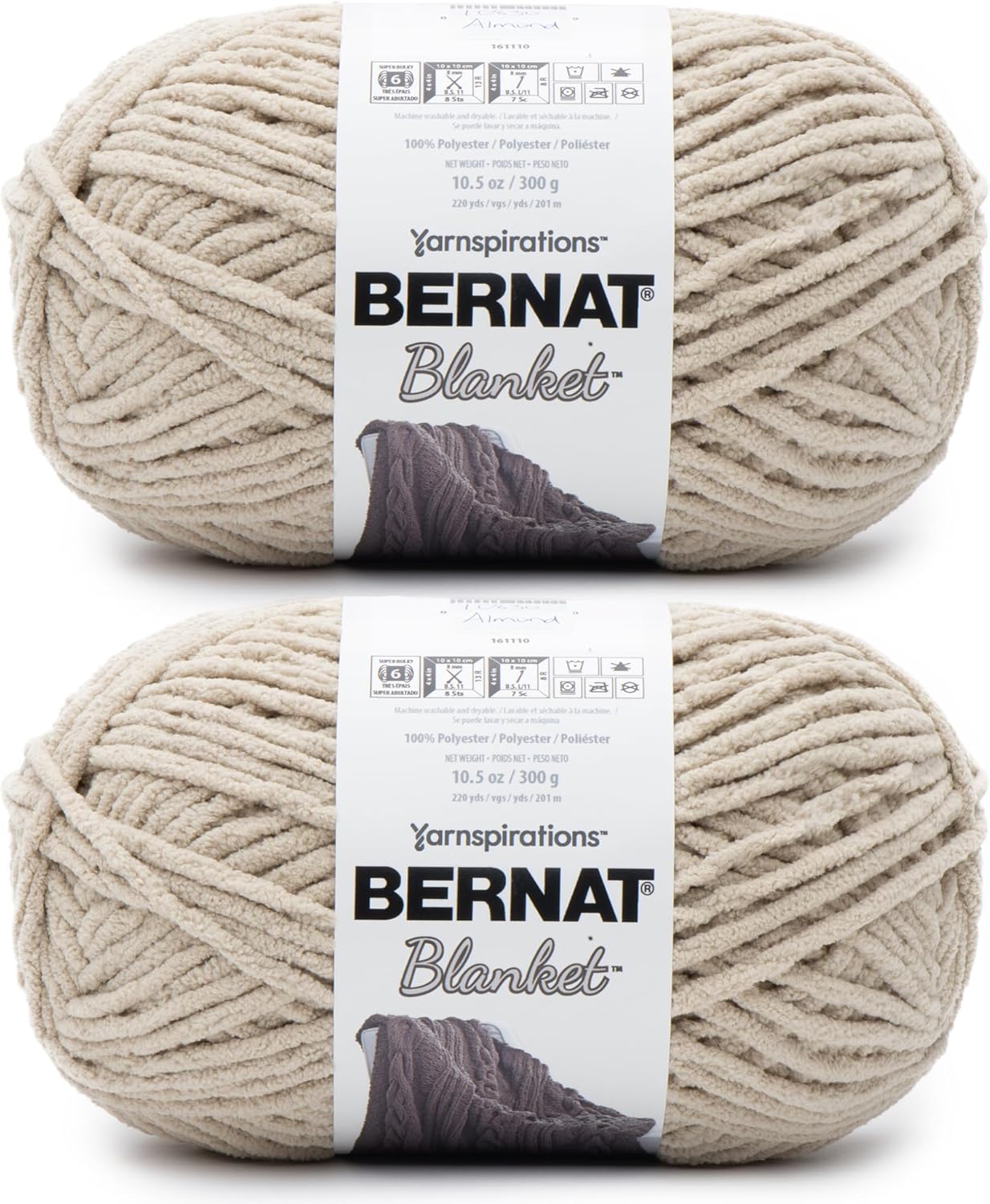 Two skeins of Bernat Blanket yarn in a light beige color, each 10.5 oz (300 g), made of 100% polyester&mdash;perfect for cozy throws or pairing with your favorite Pottery Barn pillow covers.
