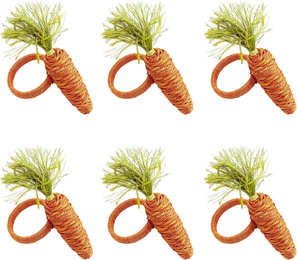 Six identical carrot-shaped napkin rings with green artificial leaves, arranged in two rows of three on a white background&mdash;perfect for adding a festive touch to your Easter decor.