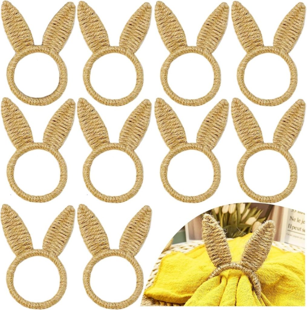 Ten woven napkin rings shaped like bunny ears are arranged in rows, with one shown in use holding a yellow napkin in the lower right corner&mdash;a charming addition to your Easter decor.