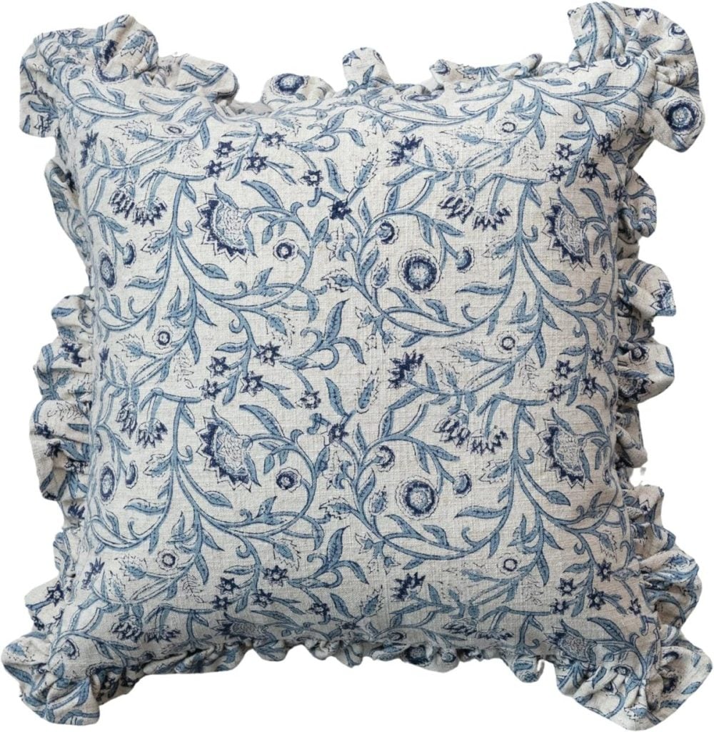 Square cushion with blue floral pattern and ruffled edges on a light background; perfect as a charming accent or as inspiration for your next DIY Easter Craft.