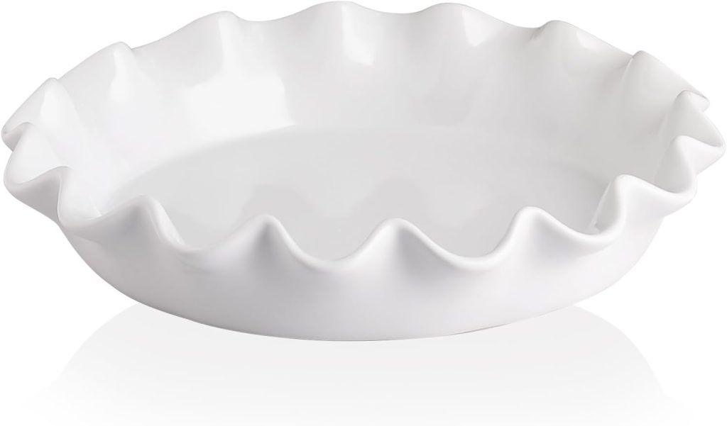 White ceramic pie dish with a fluted, wavy edge, perfect for serving your favorite desserts at Easter Brunch, shown empty against a white background.