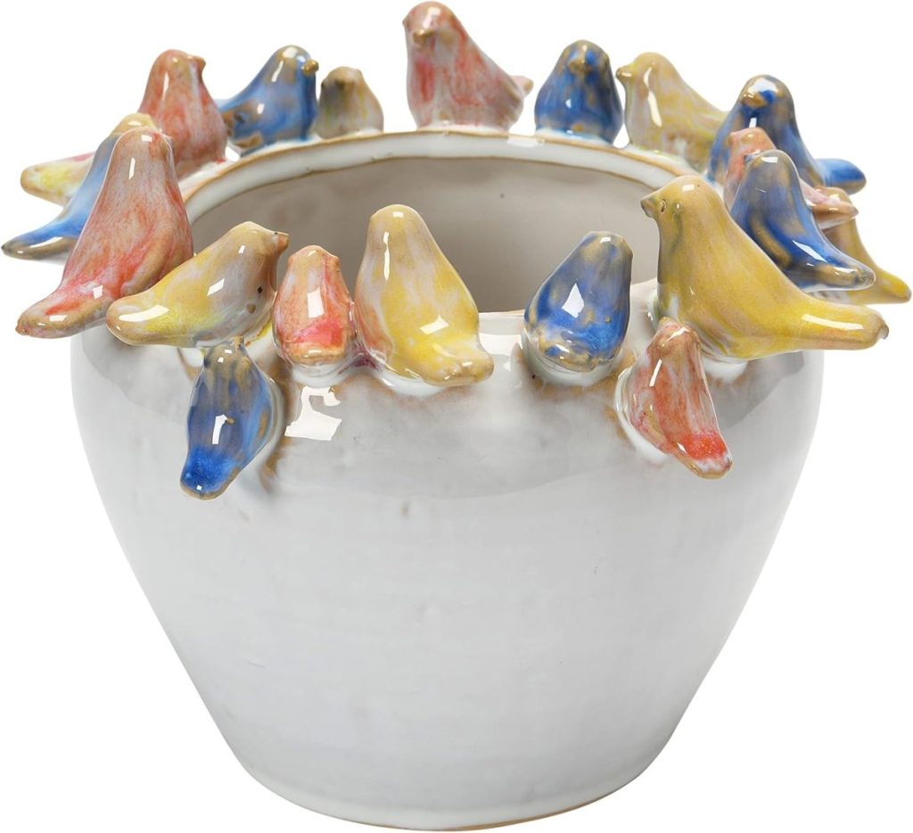 White ceramic pot with colorful bird figures perched around the rim, featuring red, yellow, and blue hues&mdash;perfect inspiration for paper craft ideas.