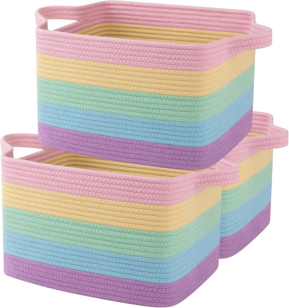 Three rectangular woven baskets with pastel rainbow stripes and handles, stacked in two layers—perfect for displaying Easter eggs in festive style.
