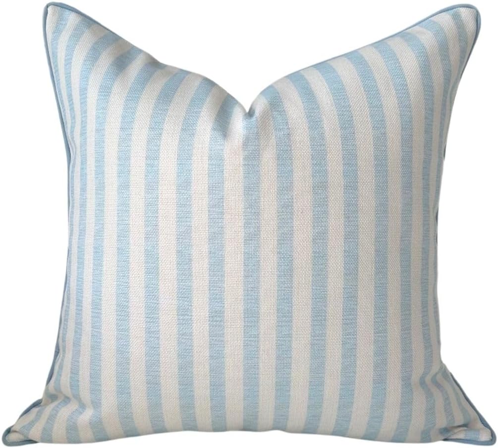 Square pillow with light blue and white vertical stripes on a fabric cover, perfect for adding a fresh touch to your Summer Decorating Ideas, shown against a plain background.