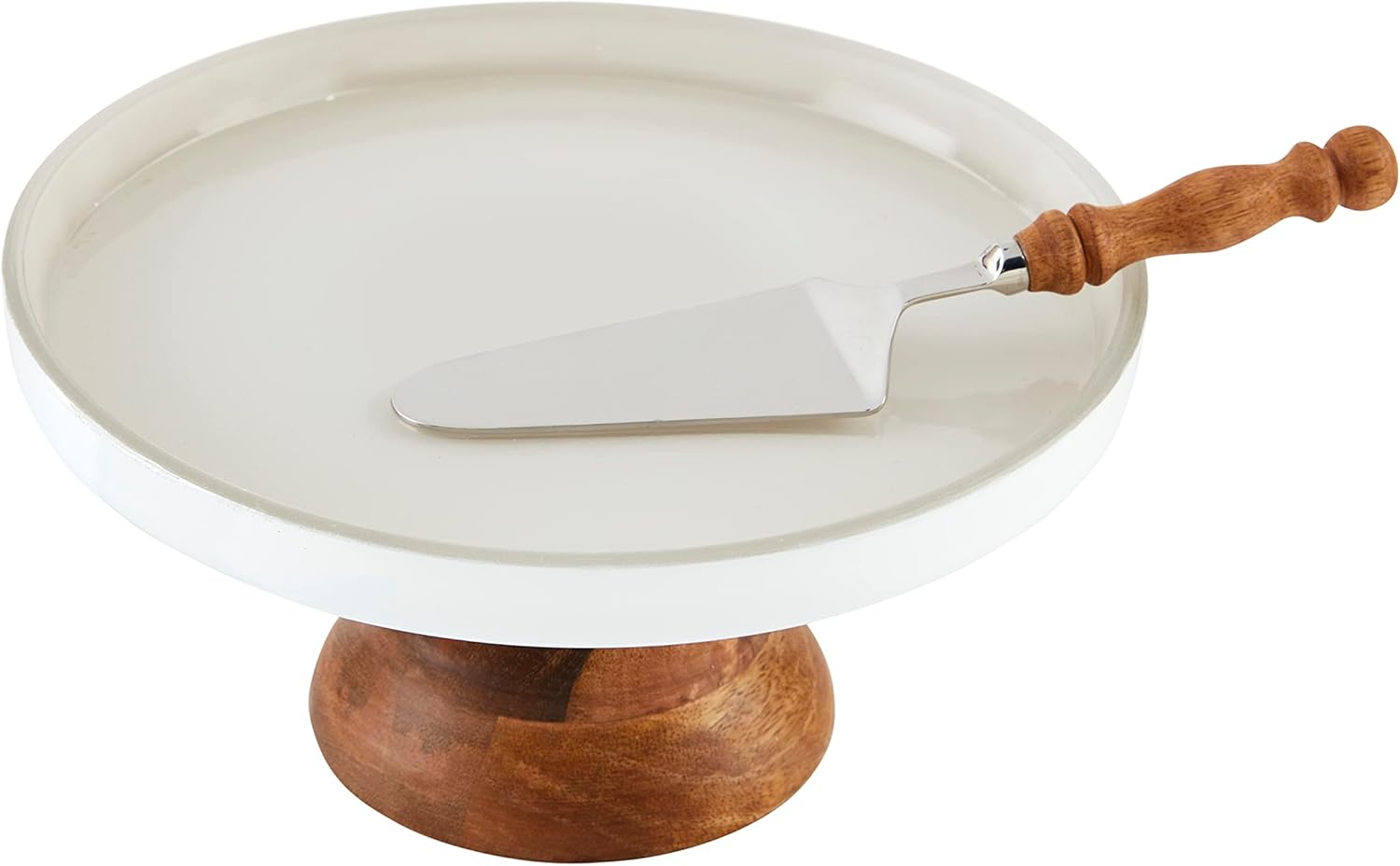 A white cake stand with a wooden base, perfect for displaying your favorite spring cake, and a metal cake server with a wooden handle placed on top.