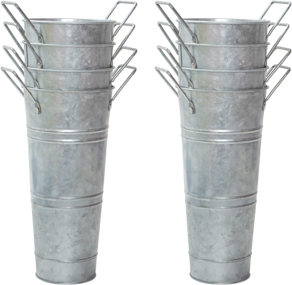 Two stacks of five galvanized metal buckets, each with wire handles, are shown standing upright and nested together&mdash;perfect for displaying summer wedding flowers.
