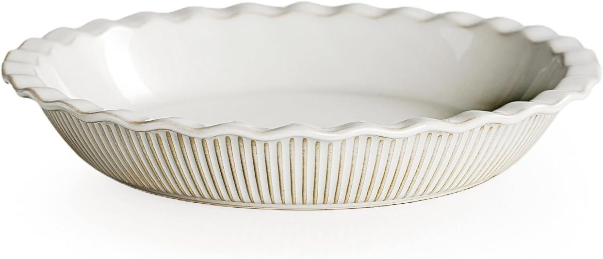 A white ceramic pie dish with fluted edges and vertical ridges around the sides, shown on a plain white background.