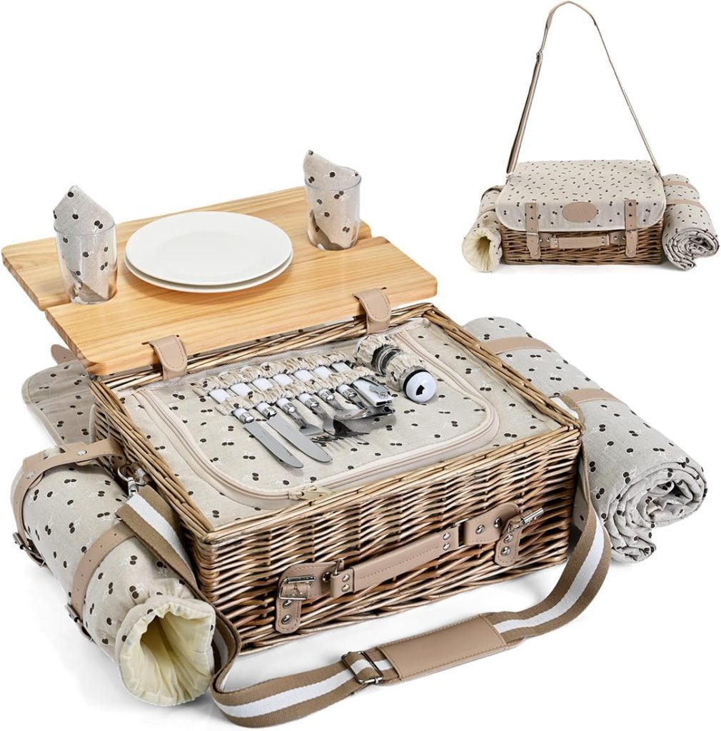 A wicker picnic basket with table, plates, cutlery, napkins, and two rolled-up blankets—perfect for Memorial Day outings—shown open and closed with a convenient carrying strap.