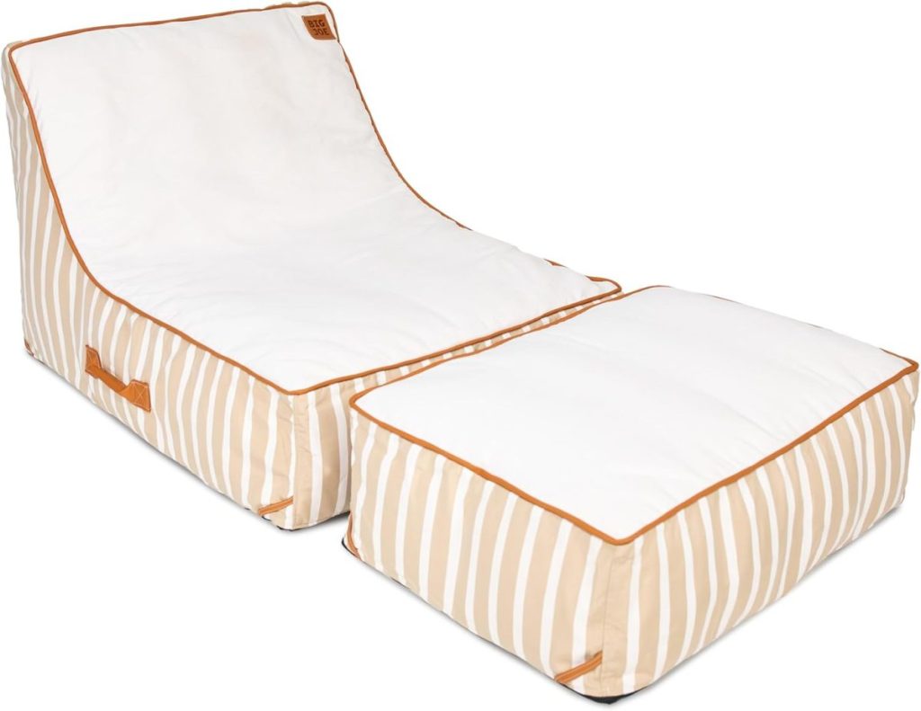 A beige and white striped bean bag chair with a matching rectangular ottoman&mdash;both featuring brown trim and side handles&mdash;brings relaxed pool party vibes to any space.
