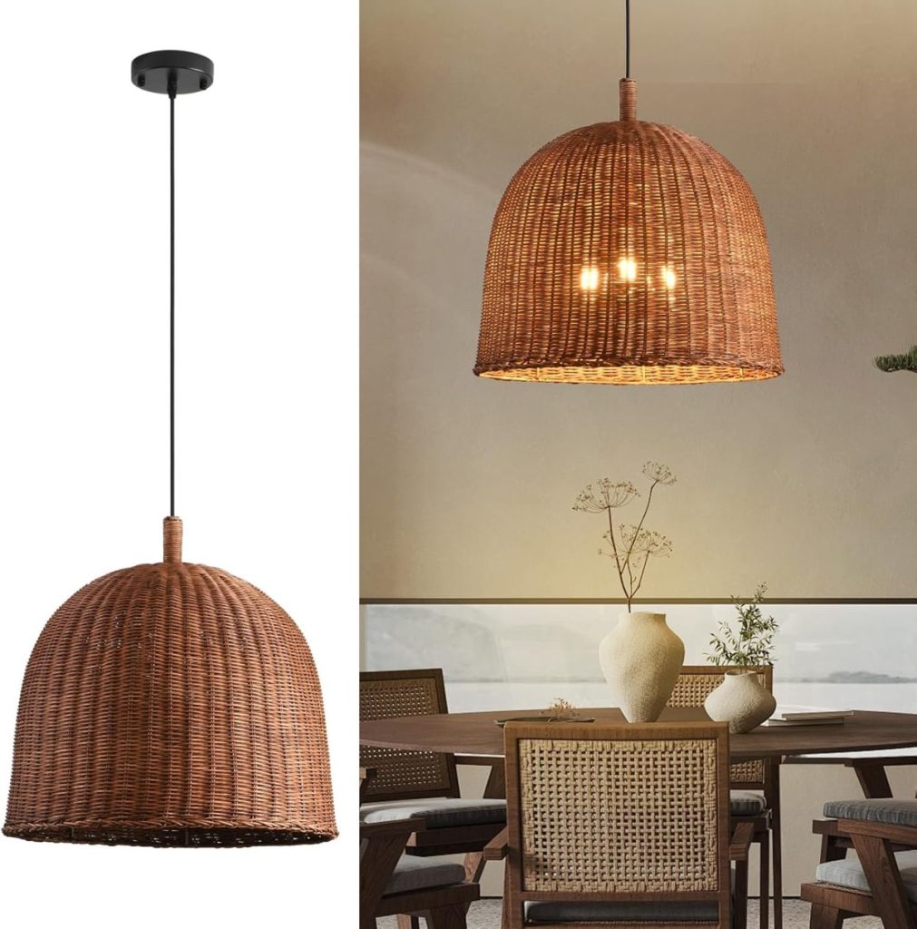 A dome-shaped woven rattan pendant light hangs over a dining table with wooden chairs and decorative vases, adding rustic charm to this farmhouse kitchen.
