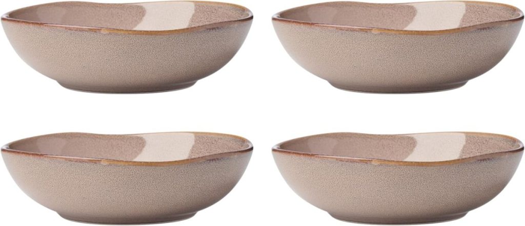 Four shallow, round beige ceramic bowls with slightly wavy rims, arranged in two rows on a white background—perfect for displaying fresh toppings or salad bar ideas.